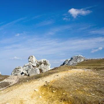 Dramatic sky over old limestone rocks Stock Photos