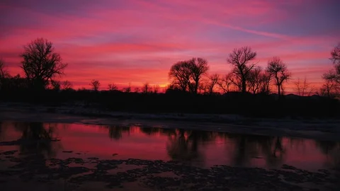 Dramatic sky over the river and landscape during sunset 動画素材 91982993