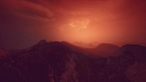 Dramatic sky over rocky mountains at sunset Illustrazione stock