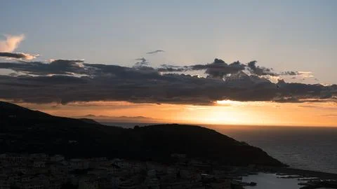 Dramatic sky over the sea at sunset. Sardinia, Italy Stock Photos