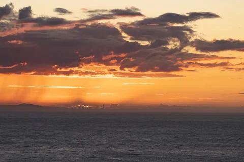 Dramatic sky over the sea at sunset. Sardinia Stock Photos