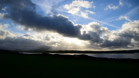 Dramatic sky over a small lake at sunset. Sardinia, Italy Stock Footage 126553379