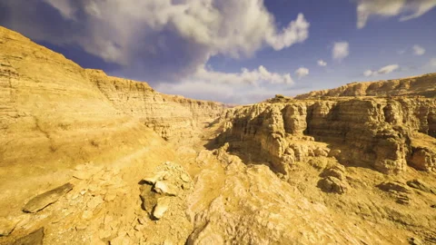 Dramatic sky over steep canyon with moving clouds and shadows 動画素材 338337733