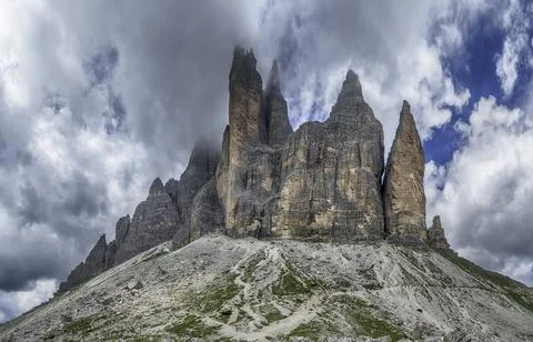 Dramatic sky over Tre Cime di Lavaredo mountains, Dolomites, Italy 写真素材