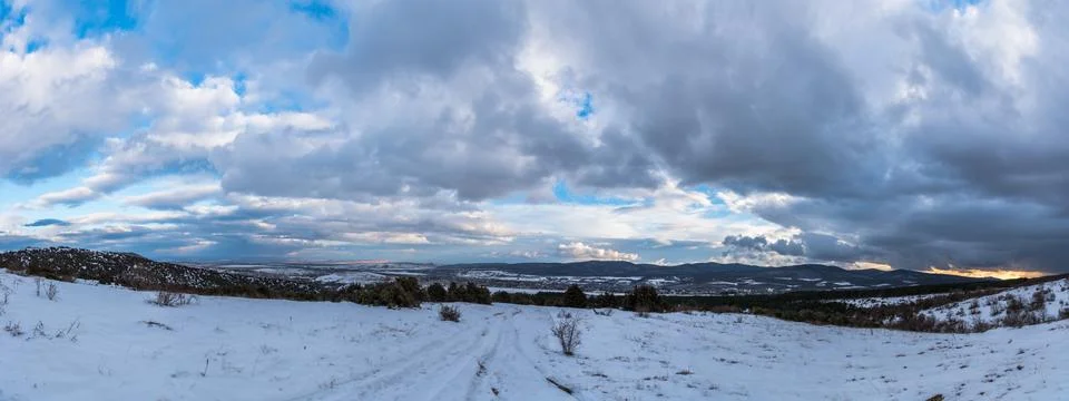Dramatic sky panorama. Stormy sunset in mountains. Stock Photos