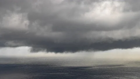 Dramatic Sky With Raining Clouds Storm over Sea, Time-Lapse in 8k Stock Footage 229572409