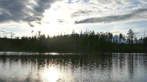 Dramatic sky reflected in the still waters of a forest lake in Sweden. Stock Footage 318196156