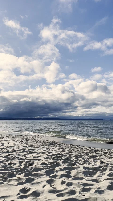 Dramatic Sky Reflected on Wet Beach Sand After Rain Stock Footage 340163977