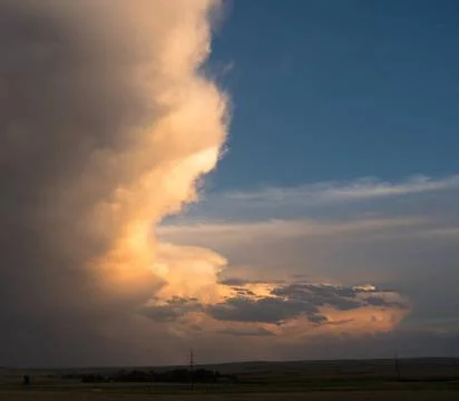 Dramatic Sky Storm Cloud Formation At Dusk Sunset The light from a sun dro... 写真素材