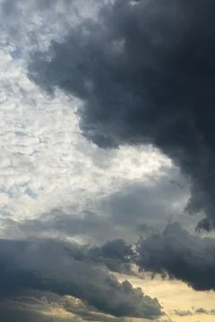 Dramatic sky with storm clouds before rain. Panoramic view of the stormy sky and Stock Photos