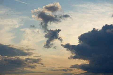 Dramatic sky with storm clouds before rain. Panoramic view of the stormy sky and Stock Photos