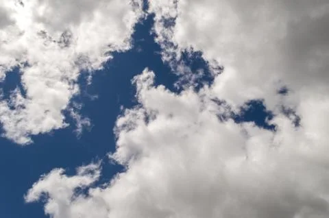 Dramatic sky with stormy clouds, back lit, blue sky. Stock-Fotos