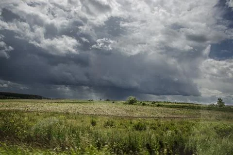 Dramatic sky with stormy clouds over the field. Russia Stock Photos