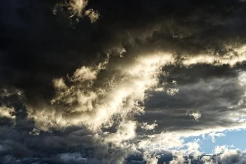 Dramatic sky with stormy clouds at sunset. Stock Photos