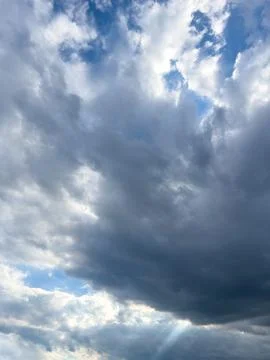 Dramatic Sky with Sun Rays Through Clouds Stock Photos