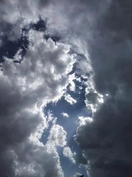 Dramatic Sky with Sunlight Breaking Through Dark Clouds Stock Photos