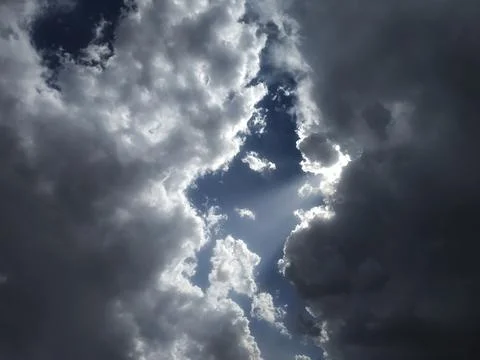 Dramatic Sky with Sunlight Breaking Through Dark Clouds Stock Photos