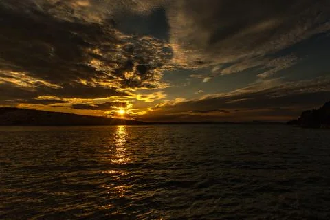 Dramatic sky, sunset in Lopar on the island of Rab, orange, red, blood-red .. Stock Photos