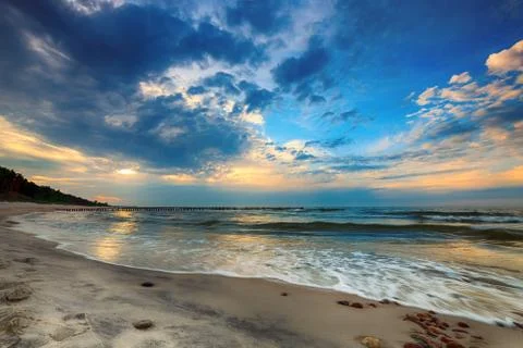Dramatic sky at sunset over Baltic sea. Stock Photos