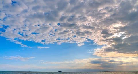 Dramatic Sky at Sunset Over the Sea Stock Photos