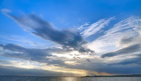 Dramatic Sky at Sunset Over the Sea Stock Photos