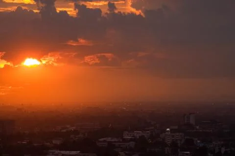 Dramatic sky sunset time in the city Stock Photos