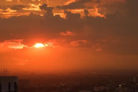 Dramatic sky sunset time in the city Stock Photos