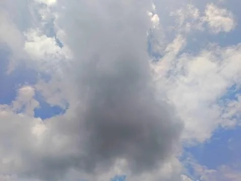 Dramatic Sky with Towering Cumulus Clouds against a Blue Backdrop Stock Photos