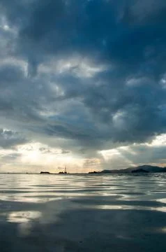 Dramatic sky in a tropical sunset. Stock Photos