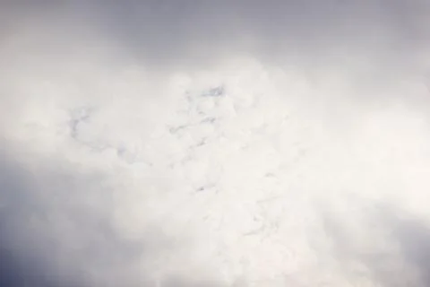 Dramatic sky with a vast expanse of grey and white textured storm clouds an.. Stock Photos