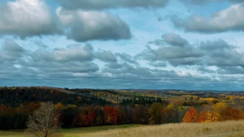 Dramatic sky view, rolling hillscape drone, autumn forest colors Stock Footage 311037213