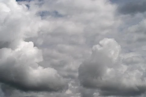 Dramatic sky visuals. Moody sky featuring textured clouds and bold contrast.. Stock Photos