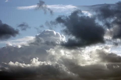 Dramatic sky.Dark clouds on the white clouds background Stock Photos
