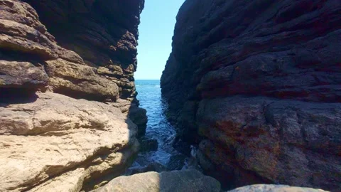 Dramatic slate rock canyon and cliff passage along the atlantic ocean coast Stock Footage 340433604
