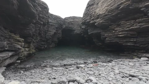 Dramatic slate rock canyon and tide pools on rocky coast in ireland Stock Footage 340458098