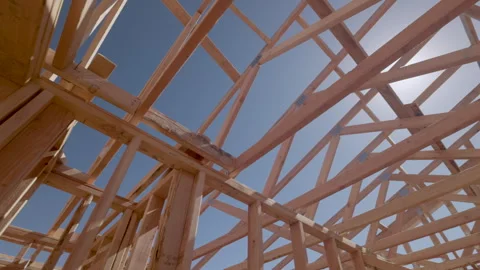 Dramatic Slow Motion Panning Movement of New Home Wood Framing Construction Site Vídeos de archivo 306091602