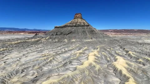 Dramatic slow motion reveal of Factory Butte rock formations Utah Stock Footage 340579242