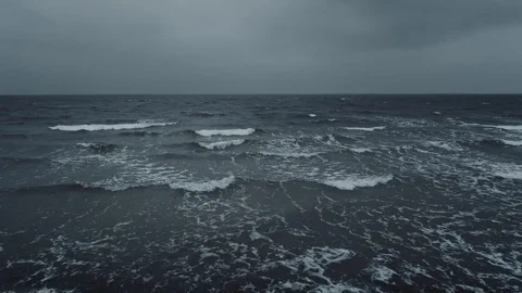 Dramatic slow motion sea or ocean waves with overcast sky at sunset. Stock Footage 122248151