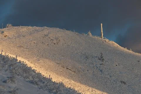 The dramatic Smerek peak in the Bieszczady Mountains covered in snow and ri.. Stock Photos