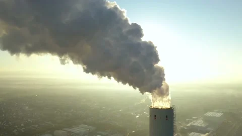 Dramatic smoke from a chimney, an industrial plant in city aerial view Stock Footage 178948470