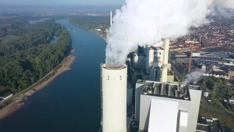 Dramatic smoke from a chimney. The smoke from the chimney obscures the sun Stock Footage 243787904