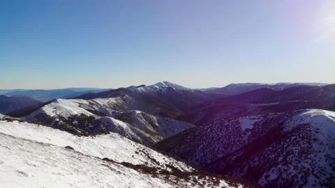 Dramatic Smooth Flight Across Snowy Ground Towards Mt Feathertop 4K Aerial Stock Footage 137547518