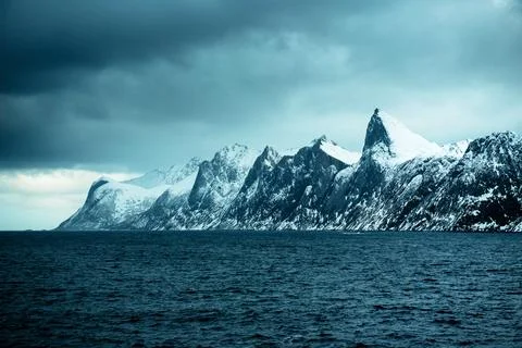 Dramatic Snow-Capped Mountains by the Ocean Stock Photos