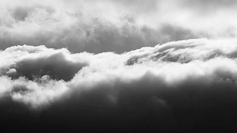 Dramatic speeding clouds in black and white Stock Footage 83730179