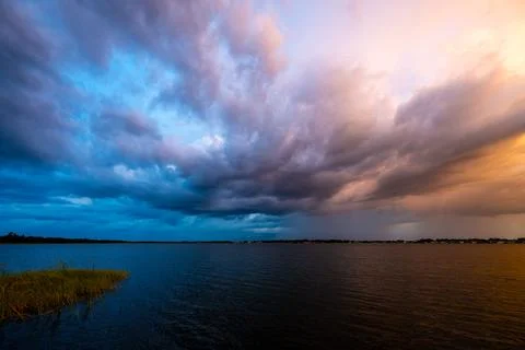 Dramatic Split Sky Over Lake at Sunset, Florida, USA Stock Photos