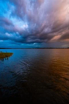 Dramatic Split Sky Over Lake at Sunset, Florida, USA Stock Photos