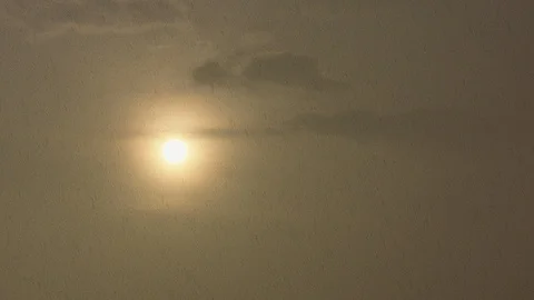 Dramatic spring rain in fron of the setting Sun Stock Footage 88705302