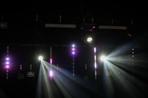 Dramatic Stage Spotlights with Light Beams in Dark Venue Stock Photos