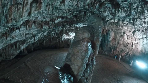 Dramatic Stalactite Formations in a Limestone Cave with Blue Light Illuminati... Stock Footage 328306998