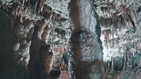 Dramatic Stalactites and Stalagmites in a Dark Underground Cave Kefalonia Greece Stock Footage 328307061